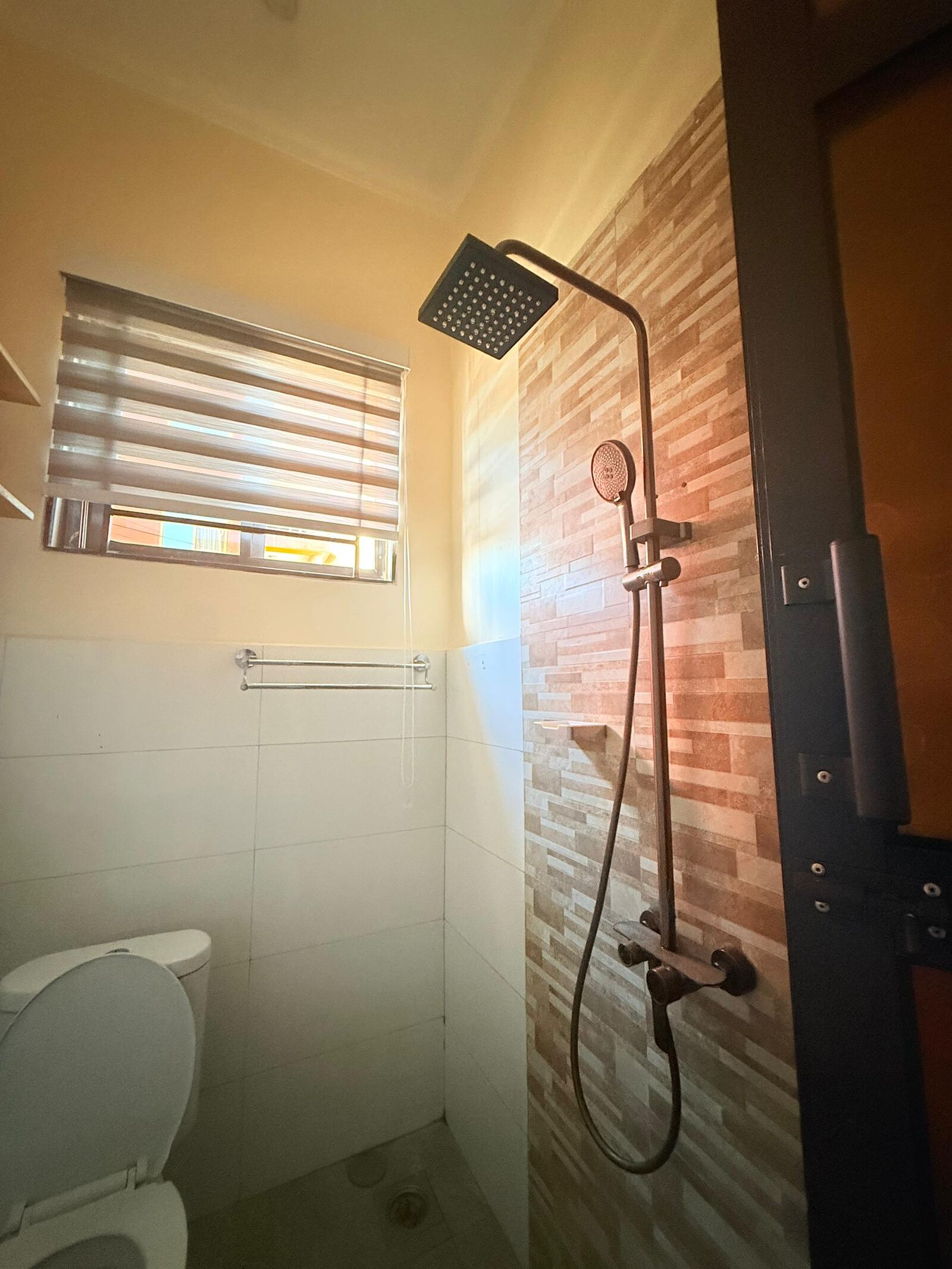 Sinza bathroom with walk-in shower