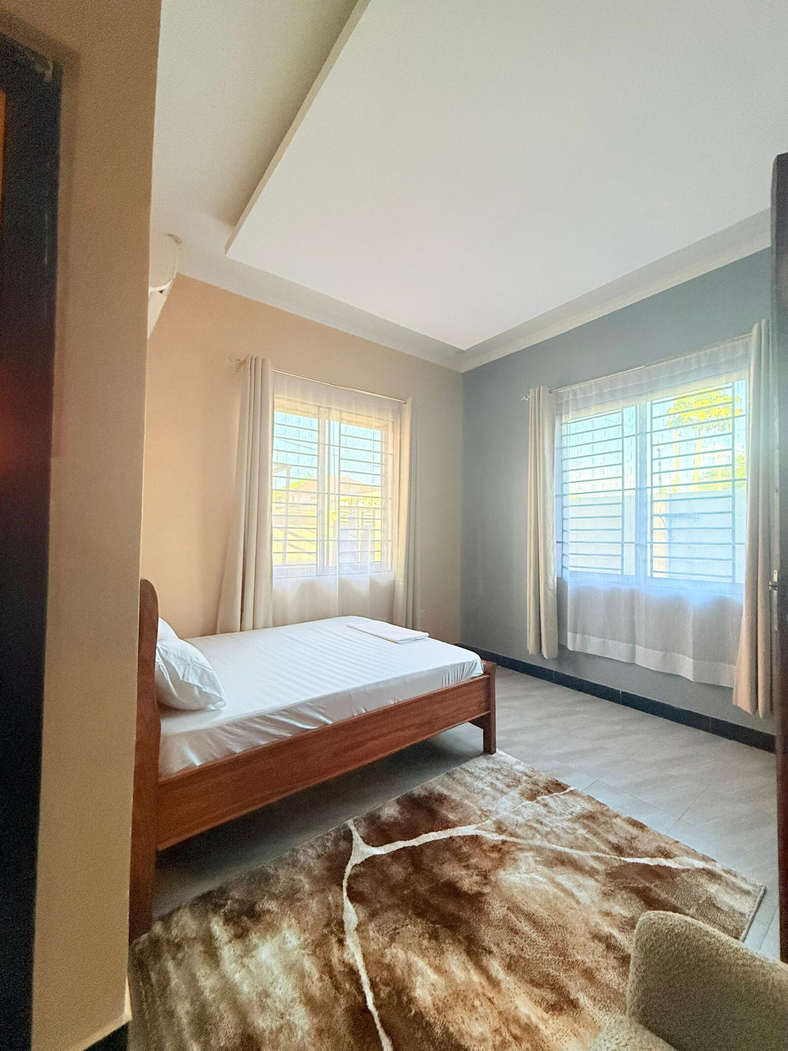 Sinza bedroom with bright window light