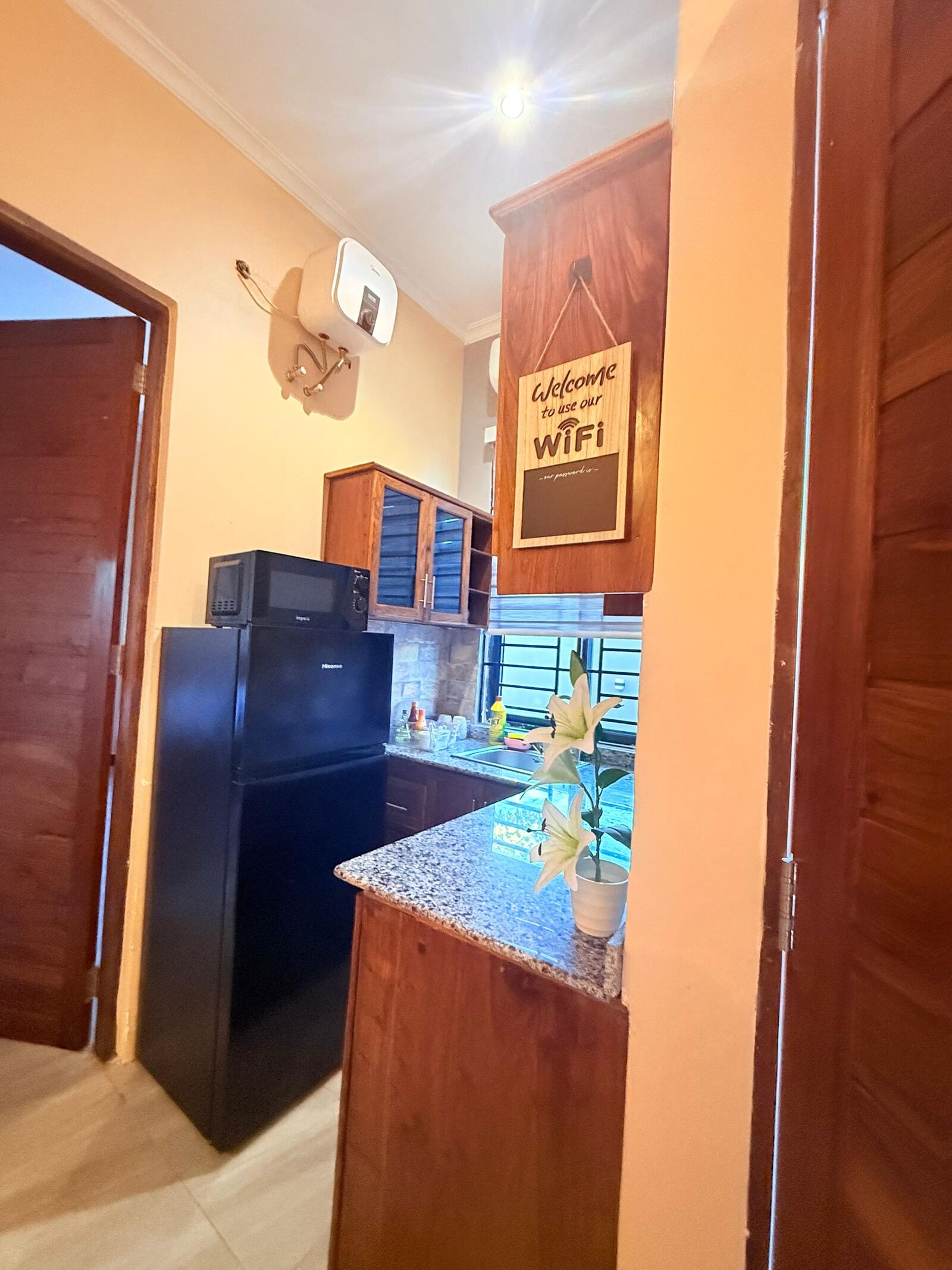 Sinza kitchen with wooden cabinets